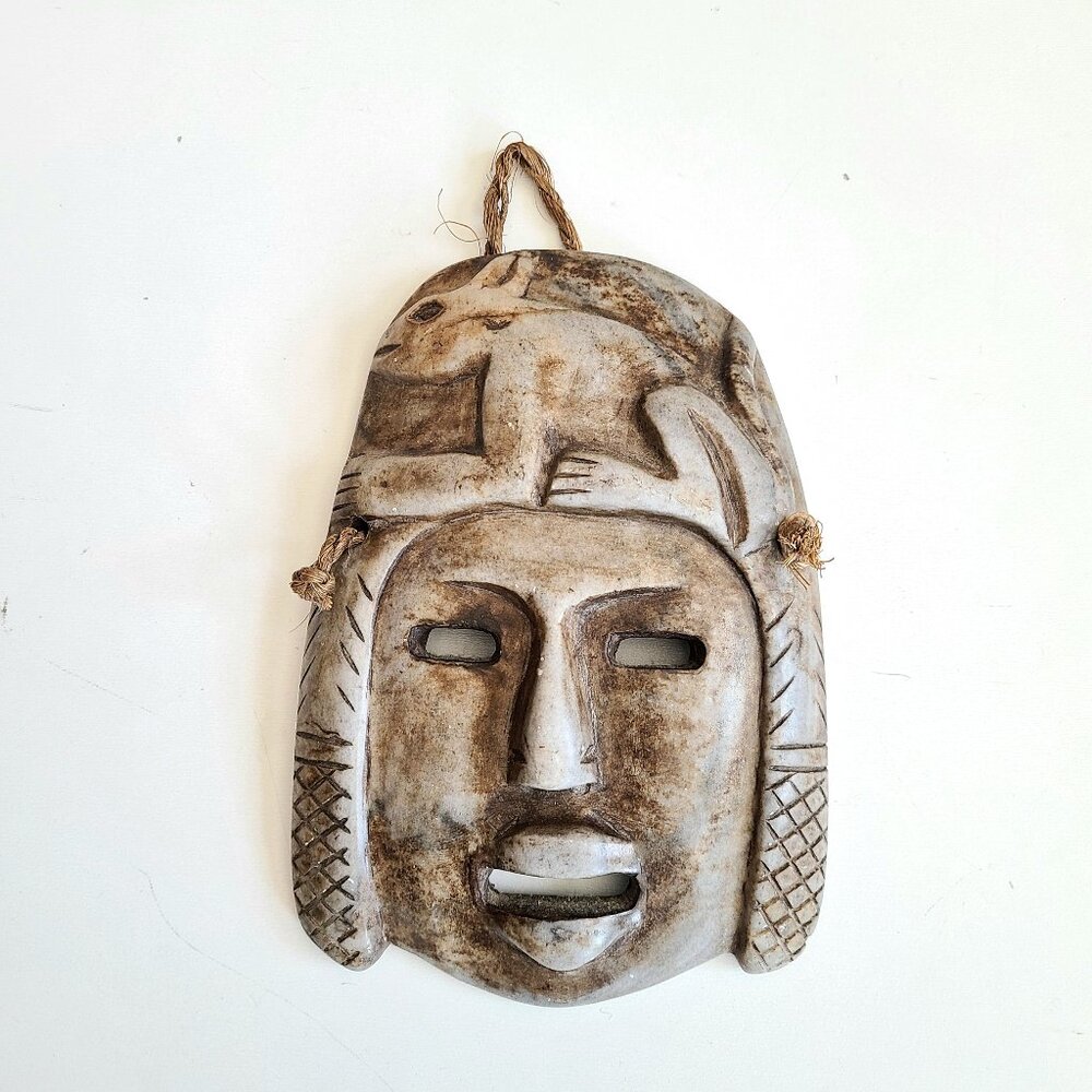 Aztec Mayan(?) carved stone man's head tribal mask with animal on forehead.